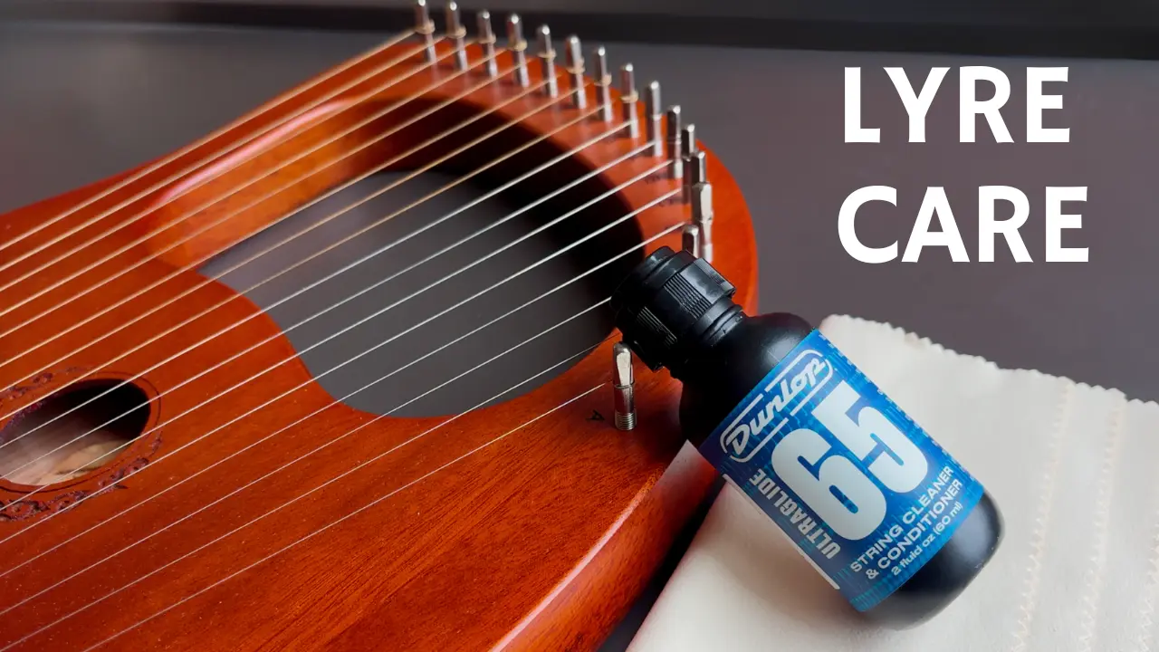 A lyre harp, a Dunlop string cleaner and conditioner, and microfiber cloths for cleaning